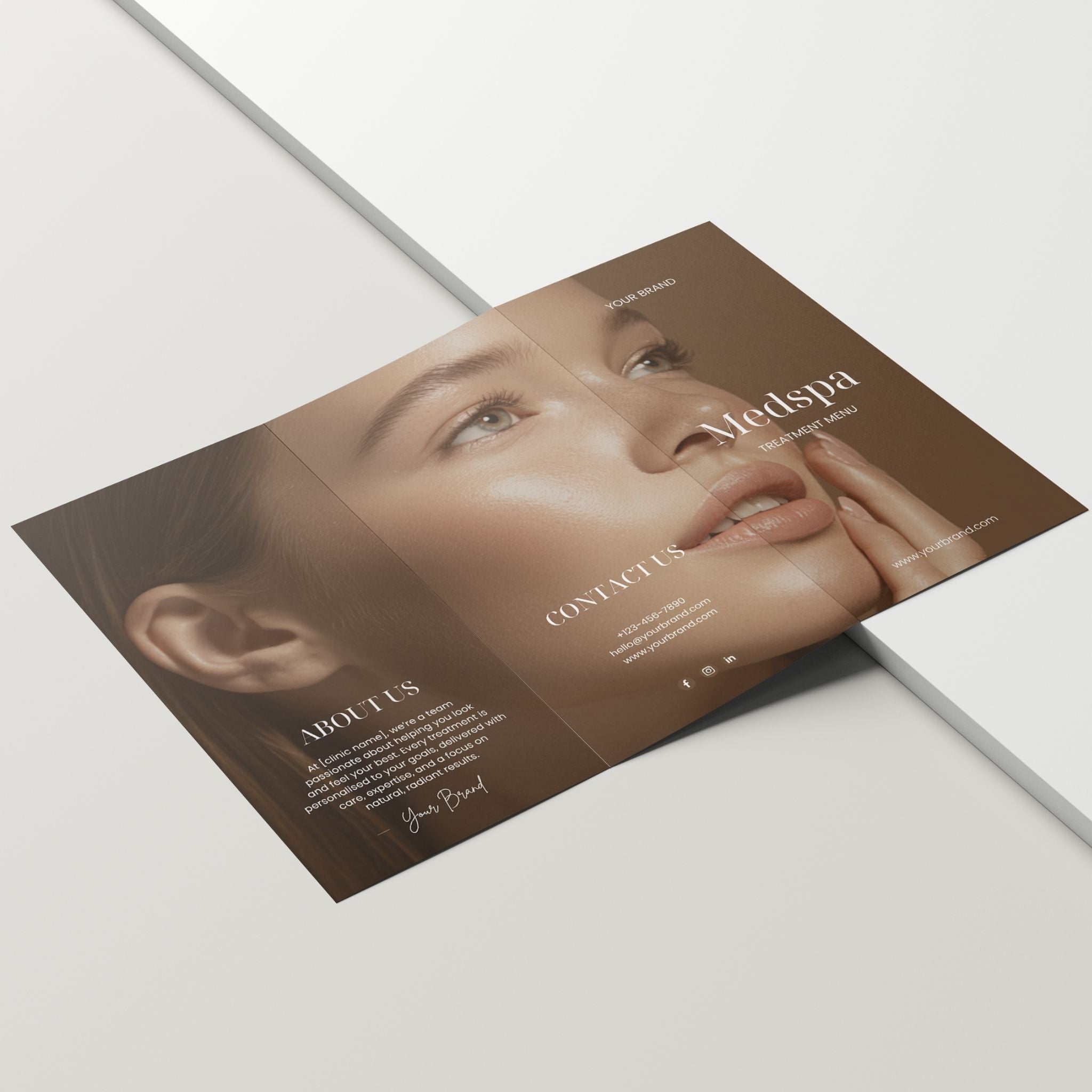 Folded brochure with a woman's face on a white background